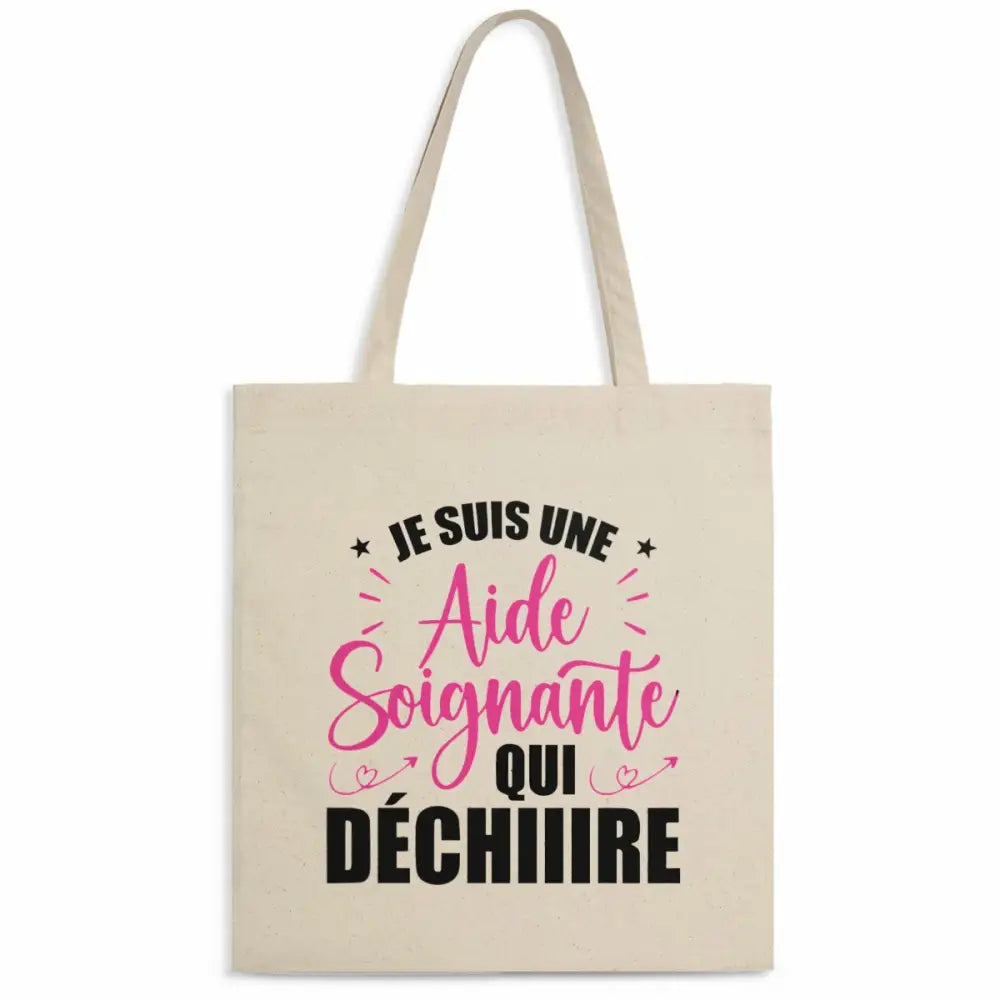 Totebag en coton biologique avec l’inscription "Je suis une aide-soignante qui déchire", sac léger de 160 g, taille unique, design engagé et éco-responsable.