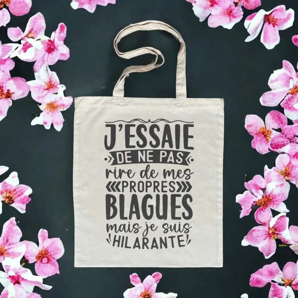 Totebag en coton biologique avec l’inscription humoristique "J'essaie de ne pas rire à mes propres blagues", sac léger de 160 g, taille unique, écologique et fun.