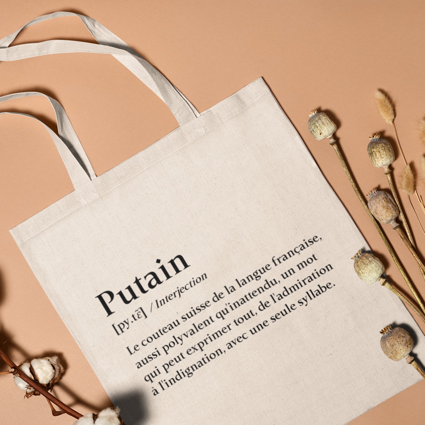 Totebag en coton biologique avec une impression type dictionnaire affichant la définition humoristique du mot "putain", sac léger de 160 g, taille unique, style argotique et éco-responsable.