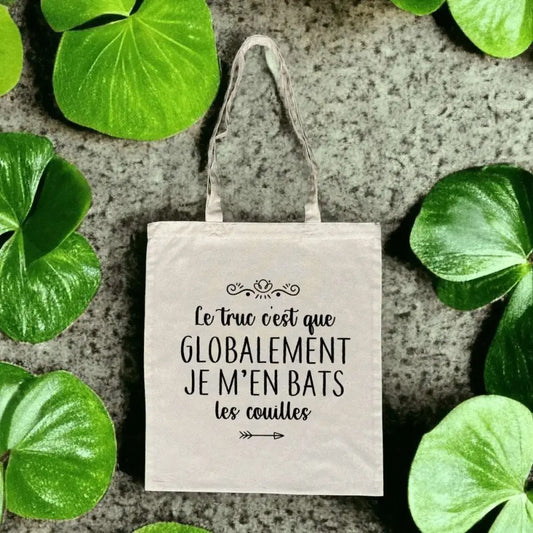 Totebag en coton biologique avec l’inscription humoristique et provocante "Globalement je m’en bats les couilles", sac léger de 160 g, taille unique, style décalé et éco-responsable.