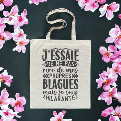 Totebag en coton biologique avec l’inscription humoristique "J'essaie de ne pas rire à mes propres blagues", sac léger de 160 g, taille unique, écologique et fun.